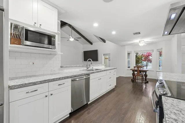 a workspace with furniture window and wooden floor