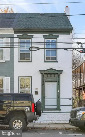 a living room with a couch and a stove