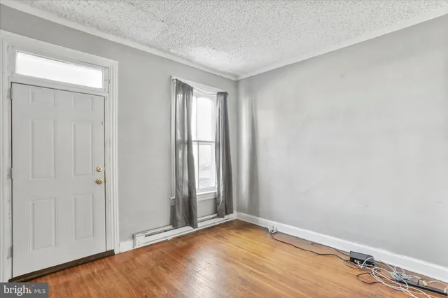 a view of entryway with stairs and wooden floor