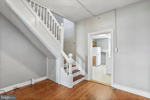 a view of entryway with wooden floor