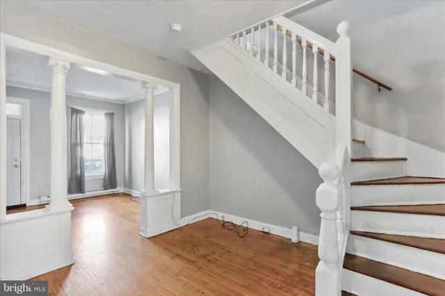 a kitchen with a stove a refrigerator and a sink