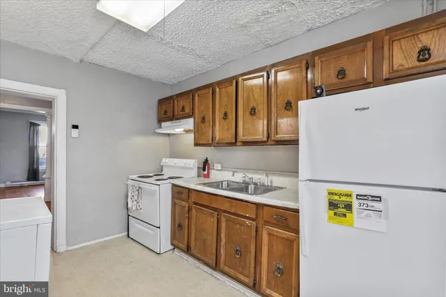 a bathroom with a sink a vanity and a mirror