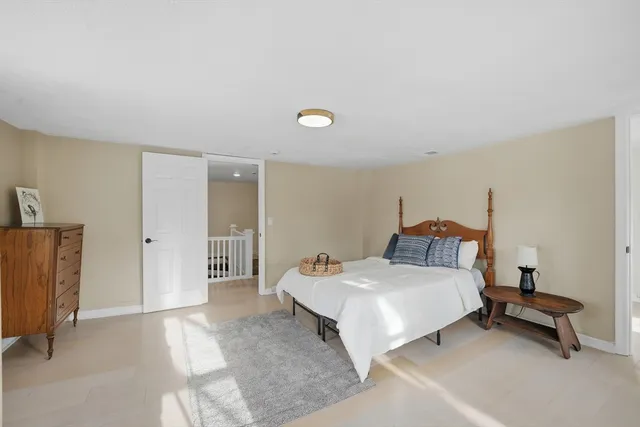 a bed room with a bed and a table