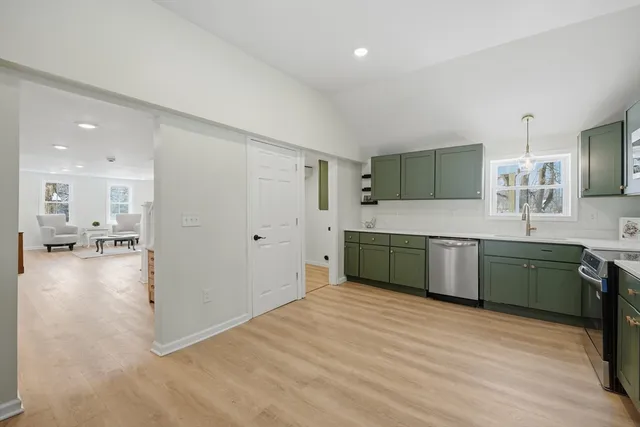 a kitchen with a cabinets and a sink