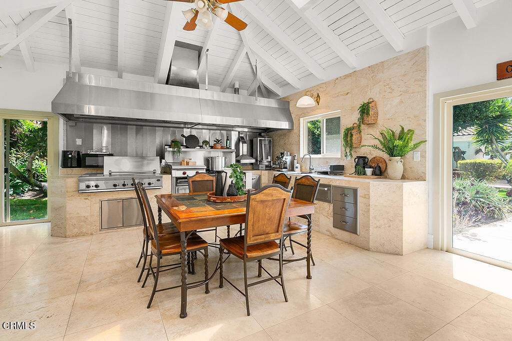 11016 Red Barn Road Camarillo, CA 93012 - Photo 20 of 72 a kitchen with stainless steel appliances kitchen island granite countertop a table and chairs in it