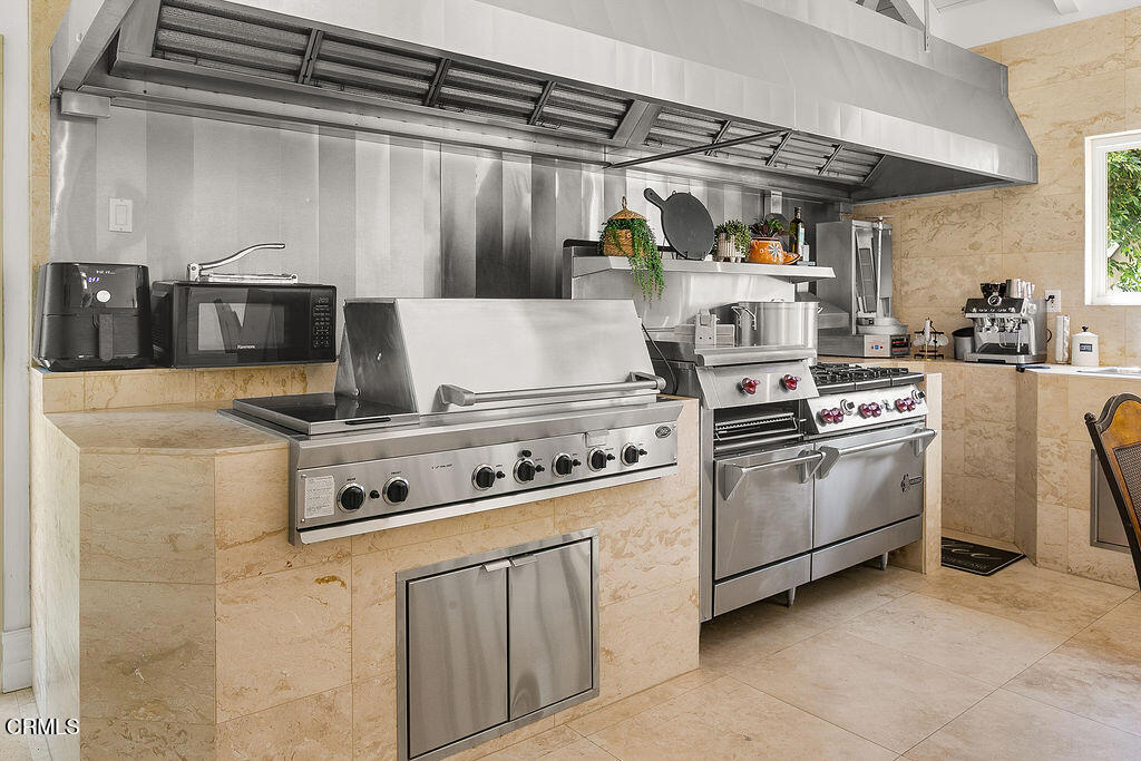 11016 Red Barn Road Camarillo, CA 93012 - Photo 22 of 72 a kitchen with a stove and a microwave