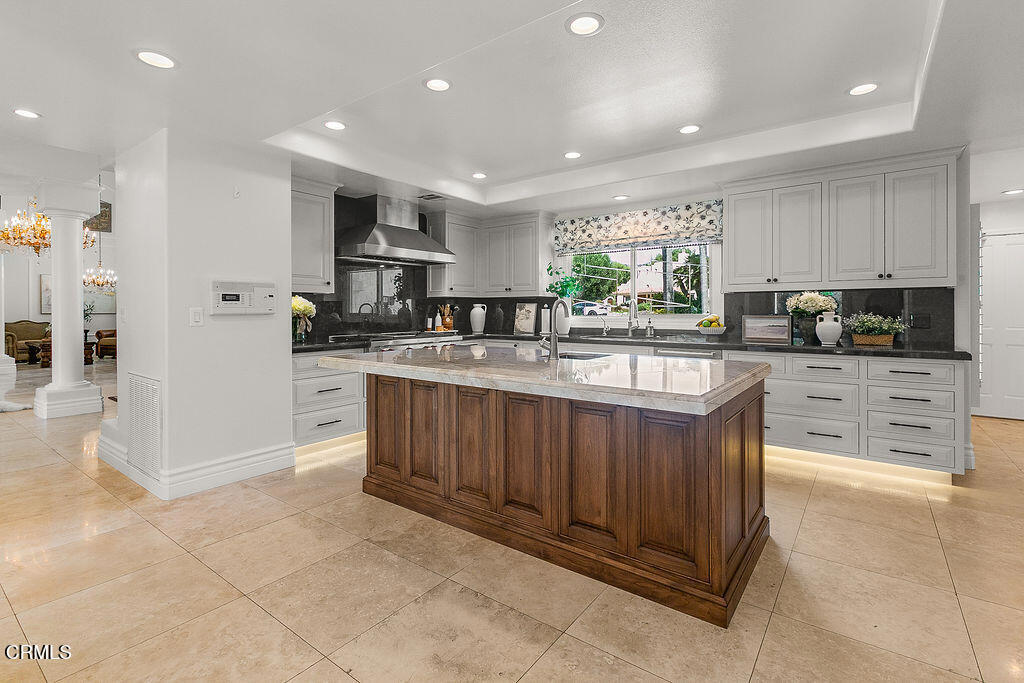 11016 Red Barn Road Camarillo, CA 93012 - Photo 23 of 72 a kitchen with stainless steel appliances kitchen island granite countertop a stove sink and cabinets