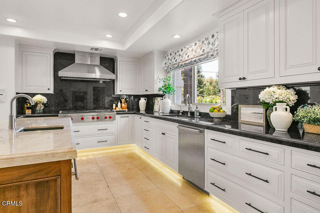 11016 Red Barn Road Camarillo, CA 93012 - Photo 26 of 72 a kitchen with a white cabinets and window