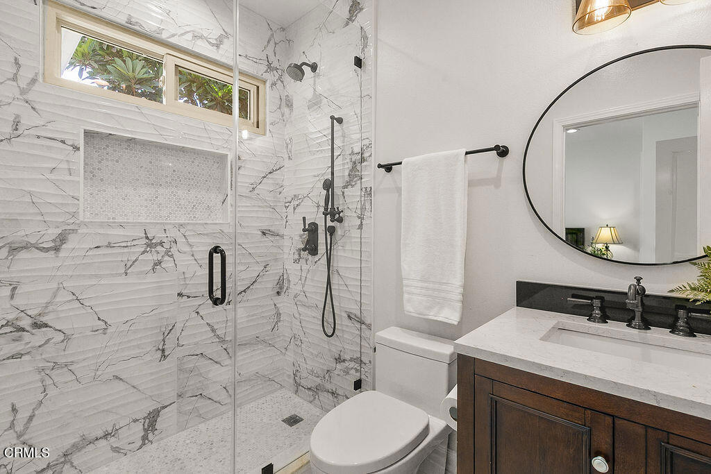 11016 Red Barn Road Camarillo, CA 93012 - Photo 32 of 72 a bathroom with a sink a toilet and a mirror