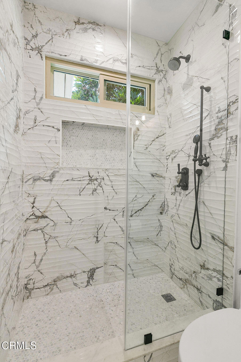 11016 Red Barn Road Camarillo, CA 93012 - Photo 33 of 72 a bathroom with a white shower a toilet and a window