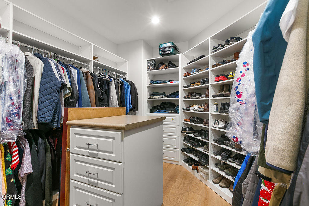 11016 Red Barn Road Camarillo, CA 93012 - Photo 56 of 72 a view of walk in closet with clothes and shoes