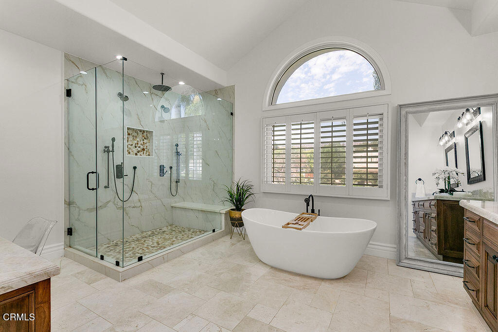 11016 Red Barn Road Camarillo, CA 93012 - Photo 57 of 72 a bathroom with a tub a sink and mirror
