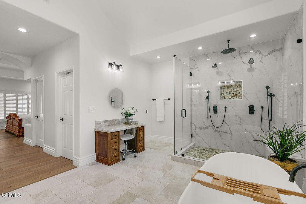11016 Red Barn Road Camarillo, CA 93012 - Photo 59 of 72 a spacious bathroom with a tub shower and mirror