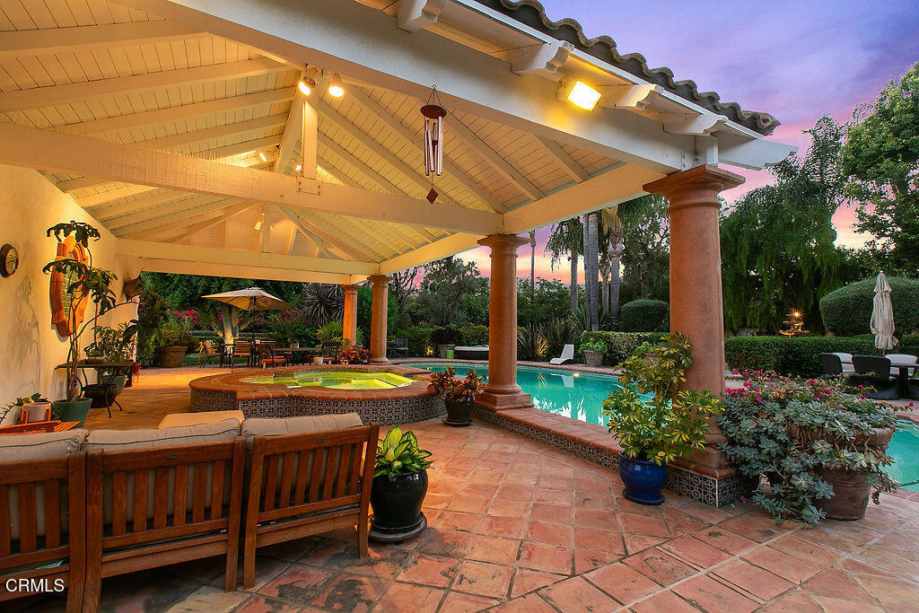 11016 Red Barn Road Camarillo, CA 93012 - Photo 6 of 72 a view of a patio with table and chairs potted plants