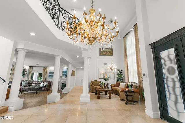 a living room with furniture fireplace and flat screen tv