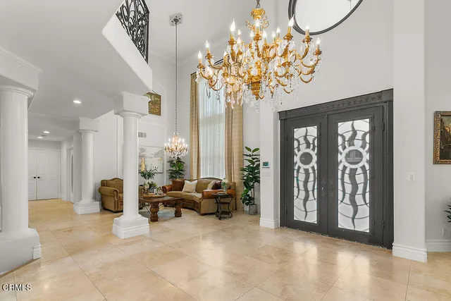 a view of a kitchen with kitchen island stainless steel appliances wooden floor and window