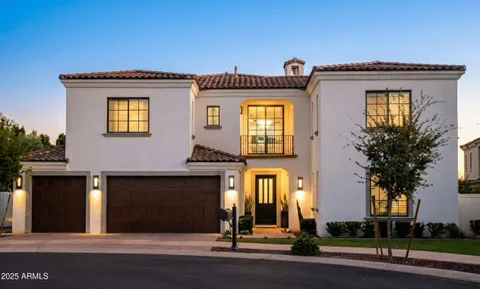 a front view of a house with garage