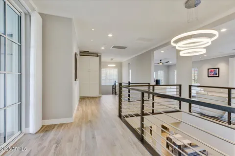 a bathroom with a large tub sink and mirror