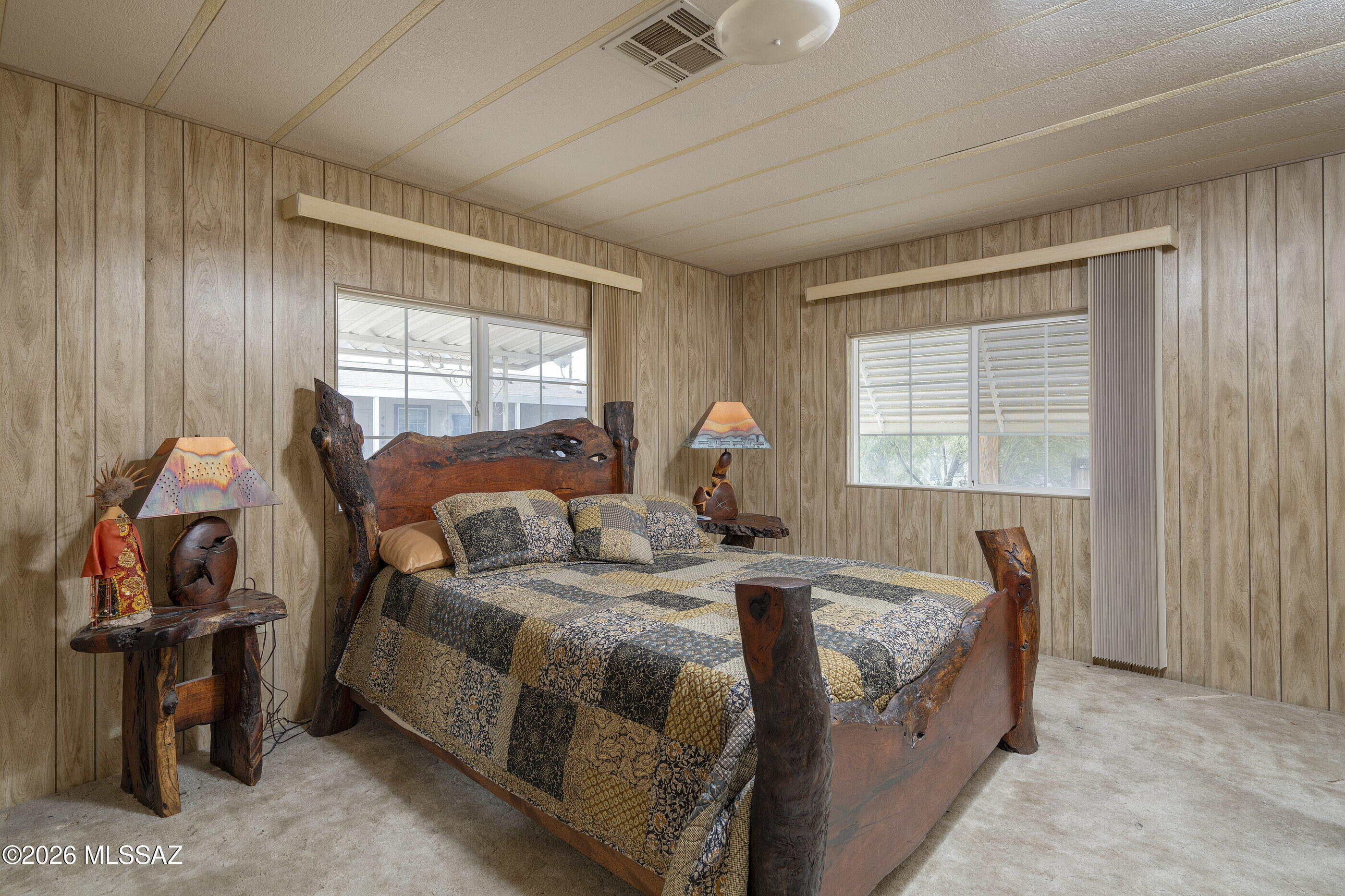 6121 West Flying M Street Tucson, AZ 85713 - Photo 11 of 25 a bed room with a bed and a window