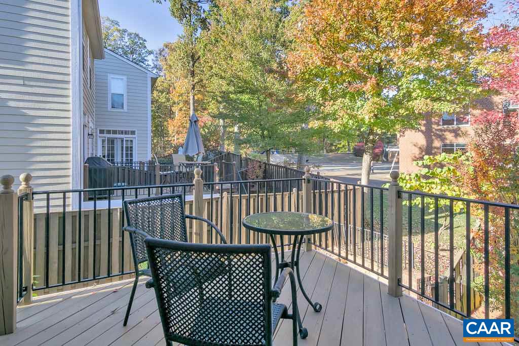 831 Rainier Road Charlottesville, VA 22903 - Photo 14 of 28 a view of a balcony with a wooden fence