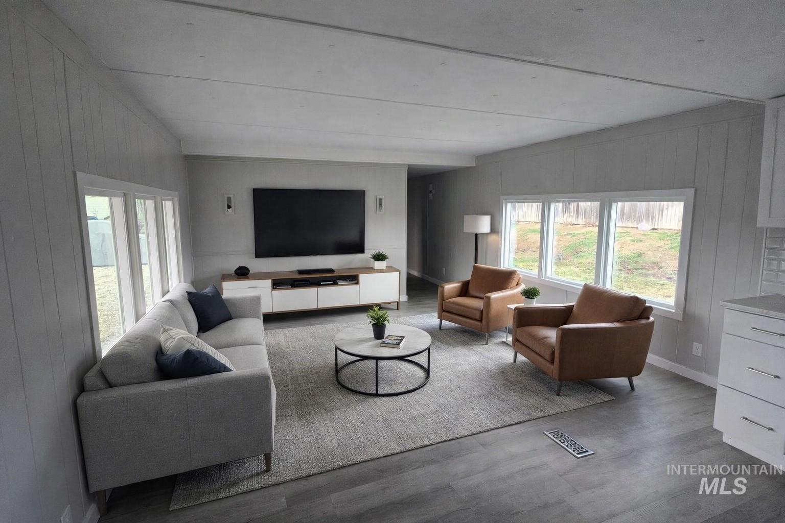 5015 East Ustick Road, Unit 172 Caldwell, ID 83605 - Photo 1 of 21 Living room with wood walls and wood finished floors