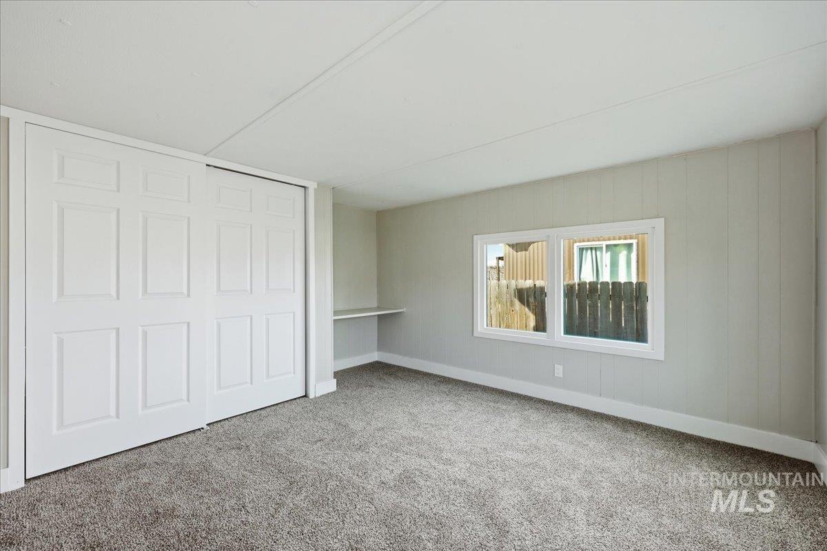 5015 East Ustick Road, Unit 172 Caldwell, ID 83605 - Photo 16 of 21 Unfurnished bedroom with a closet and carpet