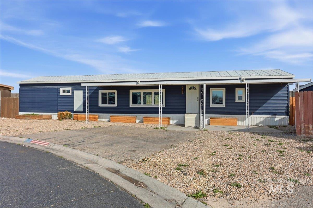 5015 East Ustick Road, Unit 172 Caldwell, ID 83605 - Photo 2 of 21 View of front facade featuring a metal roof and a porch