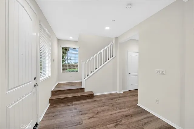a view of entryway with wooden floor