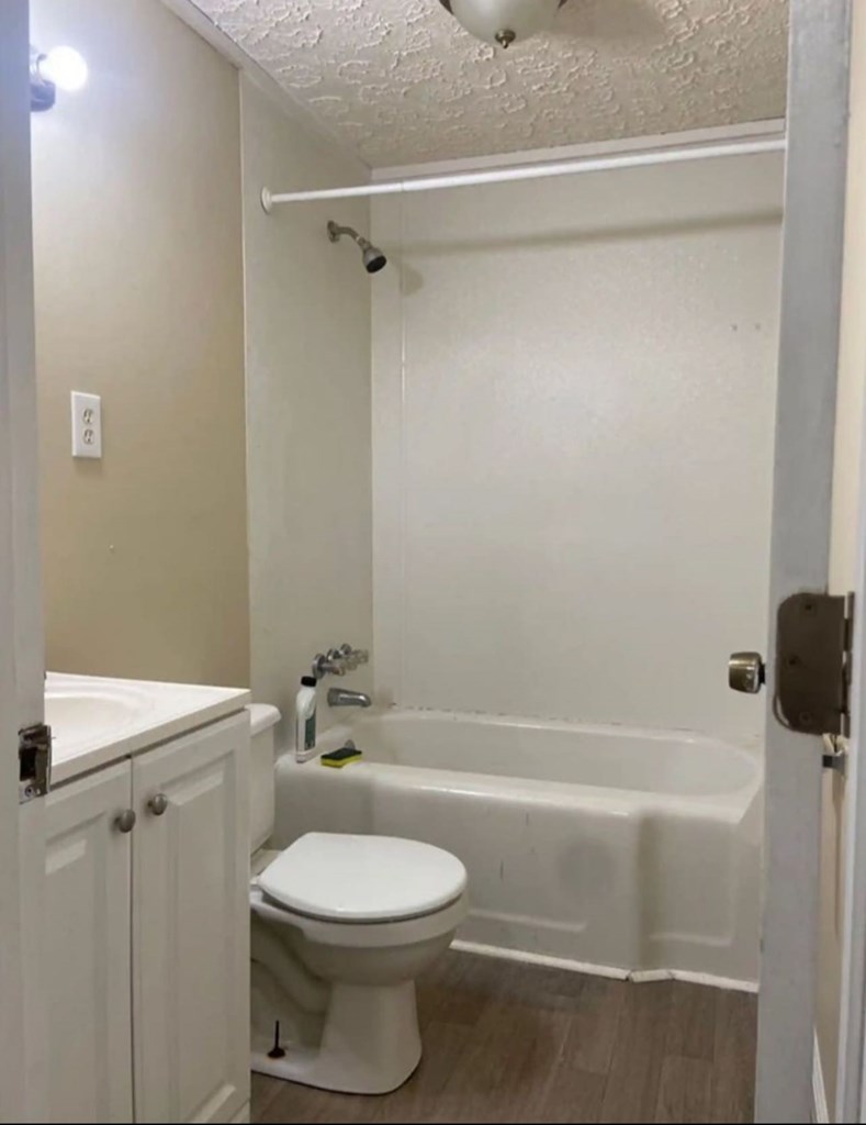 3403 Terminal Court Columbus, GA 31906 - Photo 6 of 8 a bathroom with a toilet and a shower