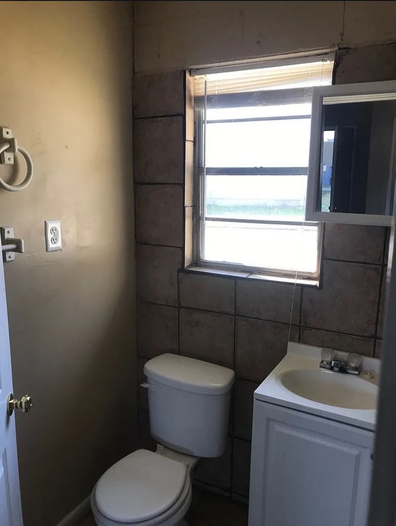 3403 Terminal Court Columbus, GA 31906 - Photo 7 of 8 a bathroom with a toilet sink and mirror