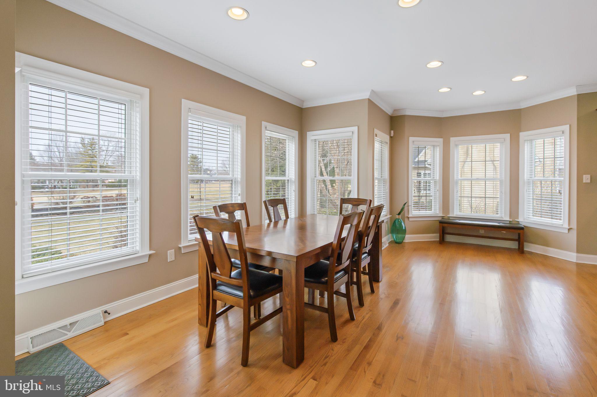 810 Woodfield Drive Lititz, PA 17543 - Photo 18 of 49 a view of a dining room with furniture and wooden floor