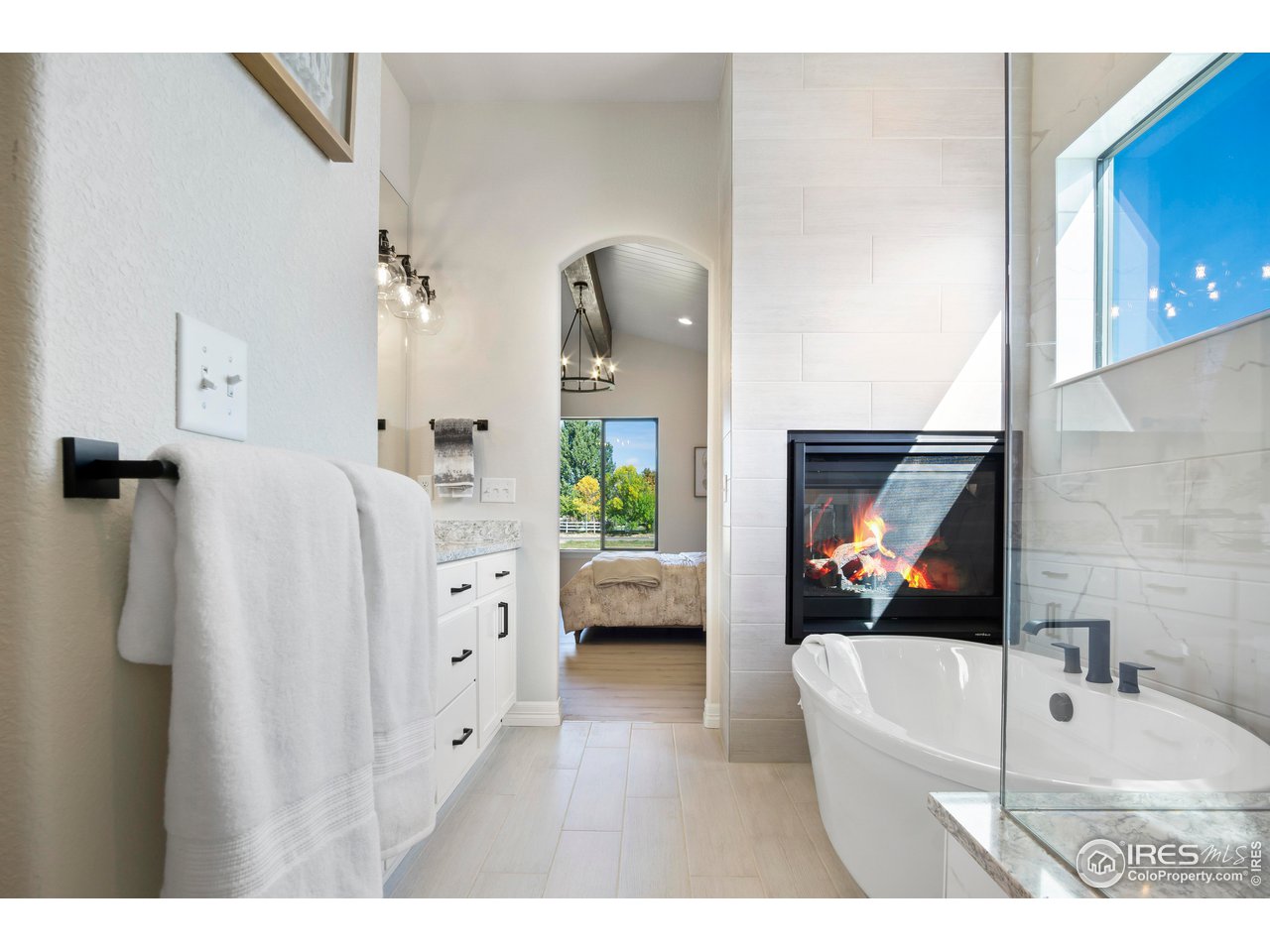 261 Cornelia Drive Windsor, CO 80550 - Photo 7 of 16 a living room with furniture and a flat screen tv