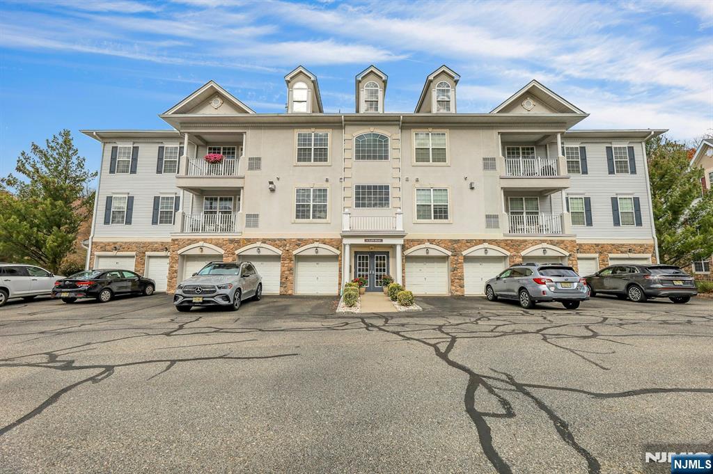 a car parked in front of a white house