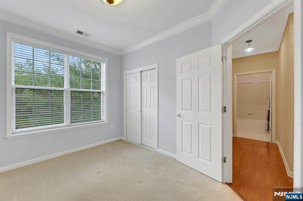 6 Cliff Road, Unit D2 Woodland Park, NJ 07424 - Photo 20 of 40 a view of an empty room with a window