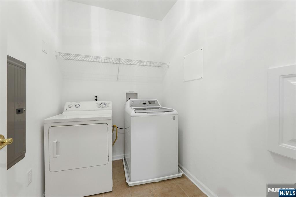 6 Cliff Road, Unit D2 Woodland Park, NJ 07424 - Photo 24 of 40 a utility room with dryer and washer