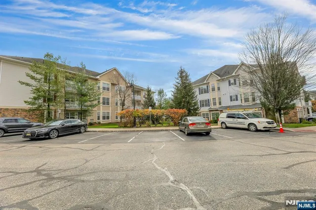 a view of cars parked in front of a building