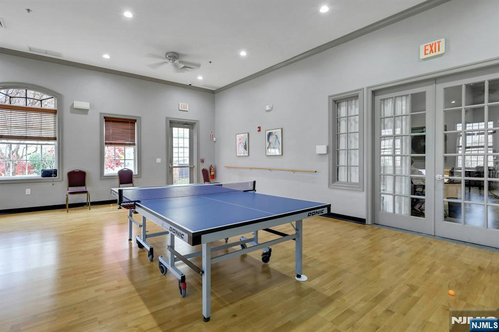 6 Cliff Road, Unit D2 Woodland Park, NJ 07424 - Photo 34 of 40 a room with furniture pool table and windows