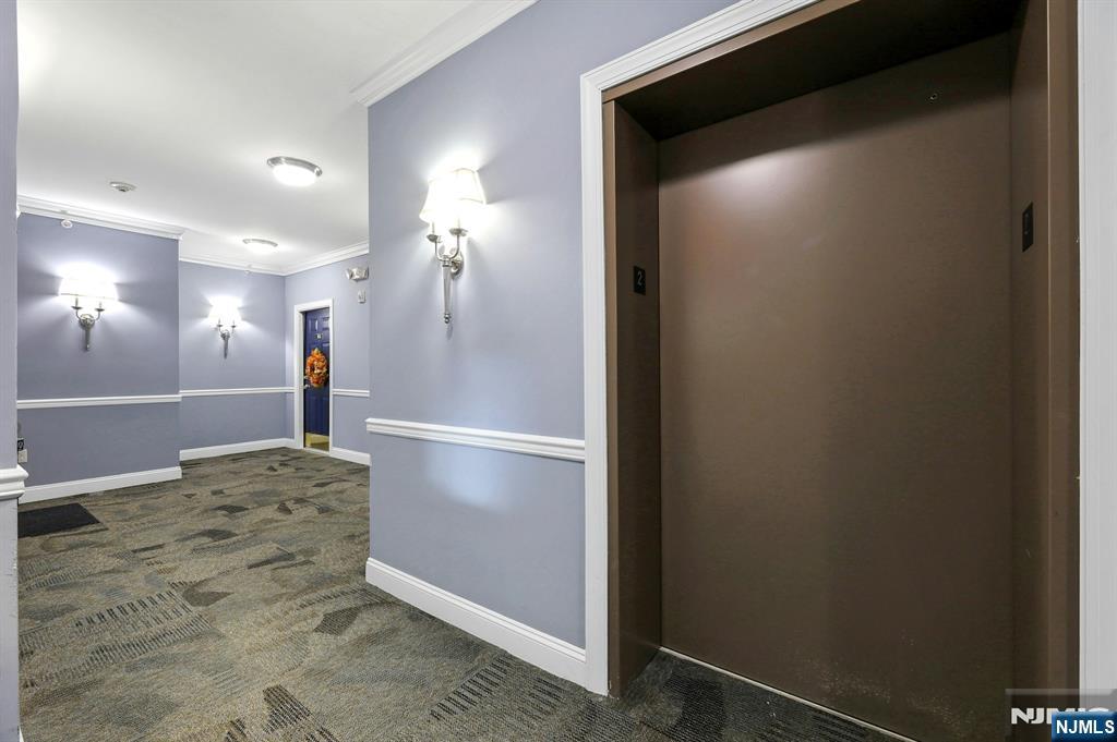 6 Cliff Road, Unit D2 Woodland Park, NJ 07424 - Photo 4 of 40 a view of livingroom with kitchen