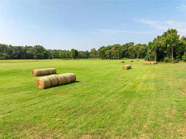 a view of a lake with houses in the back