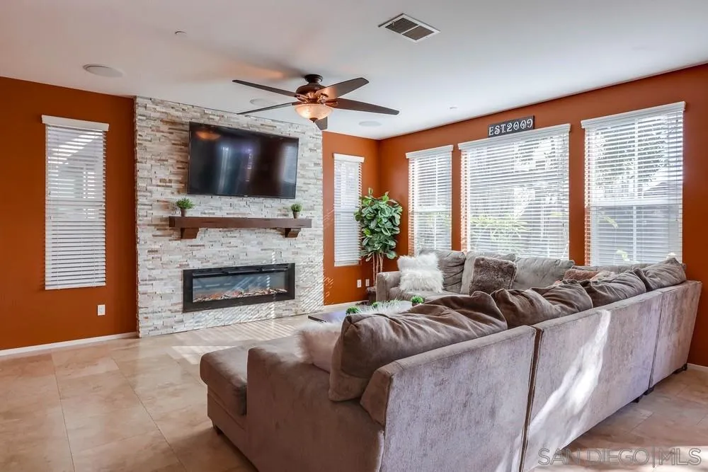 10005 Day Creek Trail Santee, CA 92071 - Photo 14 of 45 a living room with furniture large window and a fireplace