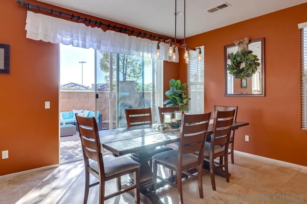 10005 Day Creek Trail Santee, CA 92071 - Photo 16 of 45 a view of a dining room with furniture window and wooden floor