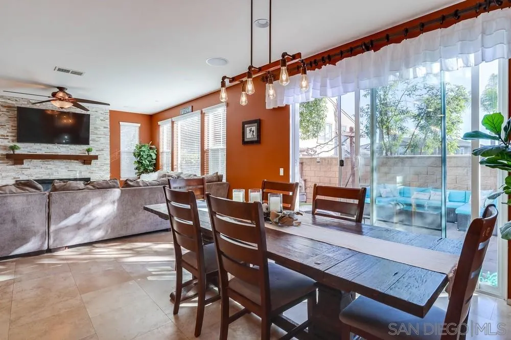 10005 Day Creek Trail Santee, CA 92071 - Photo 18 of 45 a dining room with furniture and a flat screen tv