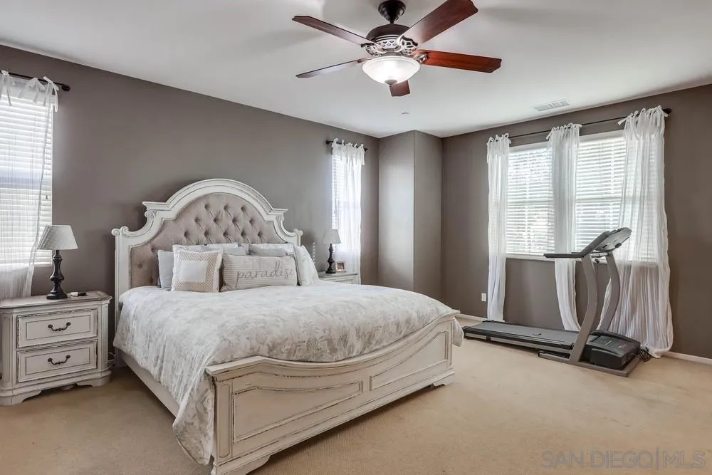 10005 Day Creek Trail Santee, CA 92071 - Photo 26 of 45 a bedroom with a bed a ceiling fan and a large window