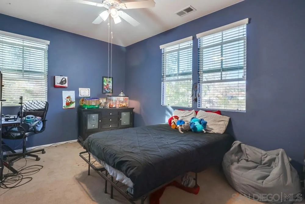 10005 Day Creek Trail Santee, CA 92071 - Photo 31 of 45 a bed sitting in a bedroom next to a window