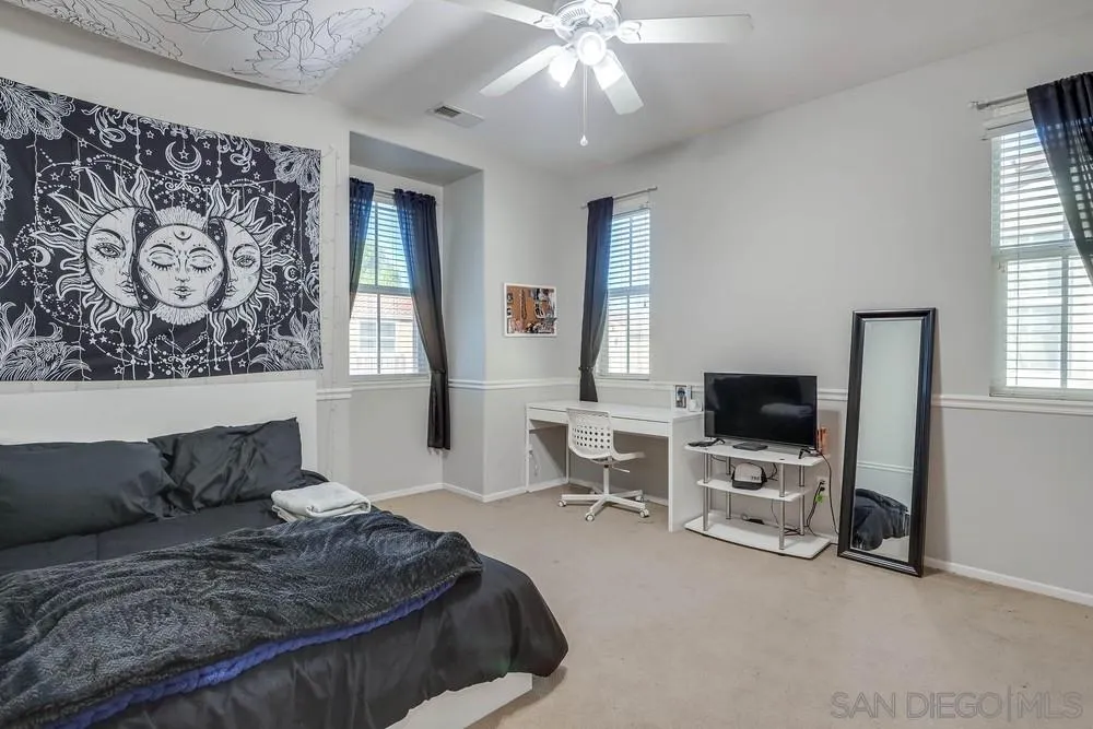 10005 Day Creek Trail Santee, CA 92071 - Photo 32 of 45 a bedroom with a bed and a flat screen tv