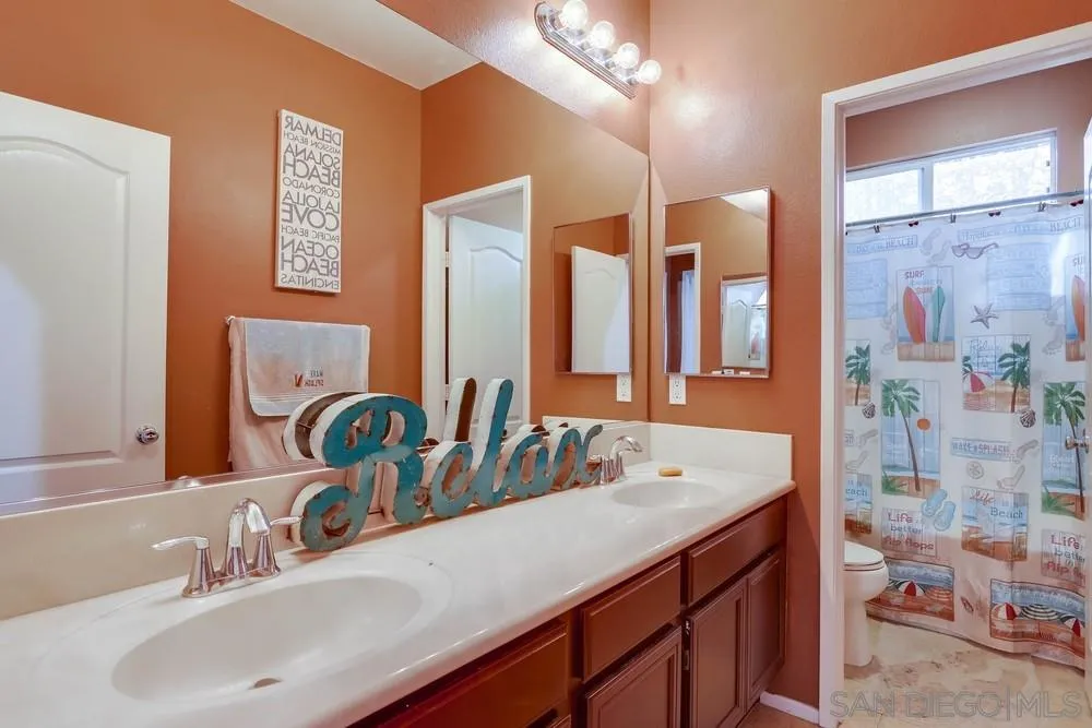 10005 Day Creek Trail Santee, CA 92071 - Photo 33 of 45 a bathroom with a double vanity sink mirror and double