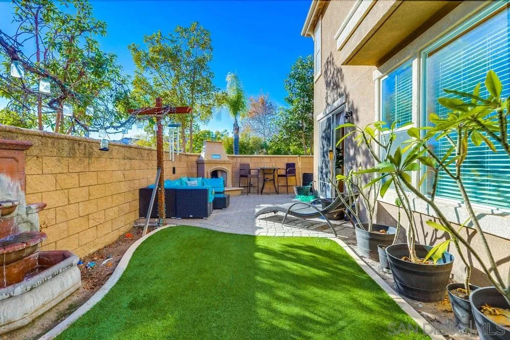 10005 Day Creek Trail Santee, CA 92071 - Photo 37 of 45 a view of a backyard with couches chairs and a table and chairs