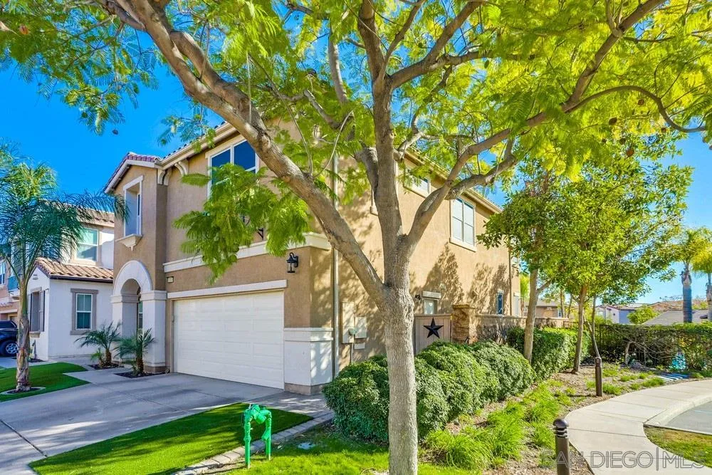 10005 Day Creek Trail Santee, CA 92071 - Photo 4 of 45 a white house that has a tree in front of it