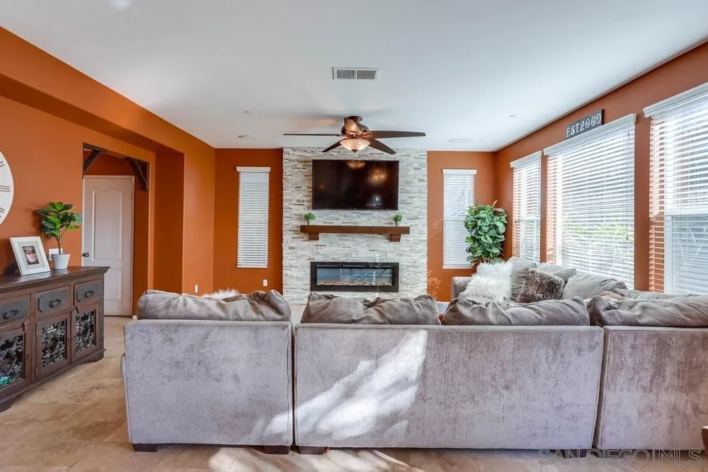 10005 Day Creek Trail Santee, CA 92071 - Photo 10 of 45 a living room with furniture and a flat screen tv