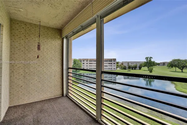 a view of balcony with furniture
